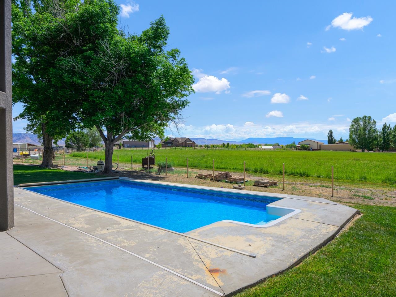 1140-23 23 1/2 Road Grand Junction, CO 81505 - Photo 9 of 42 a view of an outdoor space and swimming pool