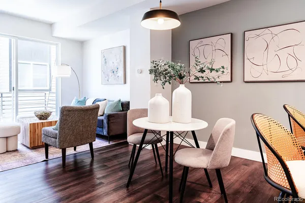 a view of a dining room with furniture and wooden floor