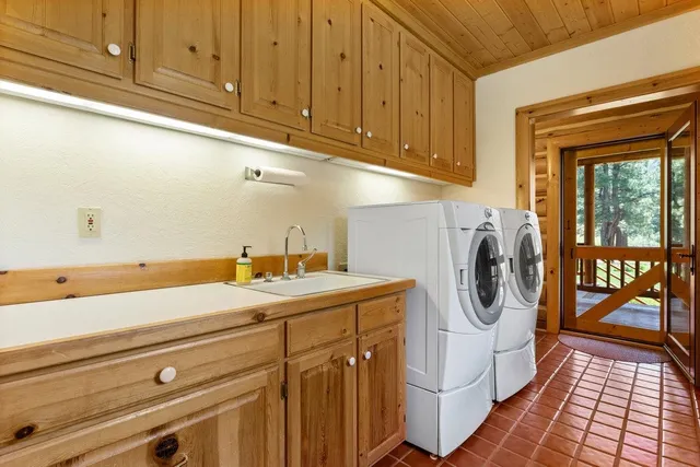 a view of a porch with wooden floor and iron stairs