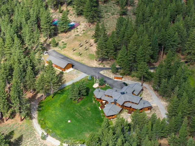 a front view of a house with a big yard