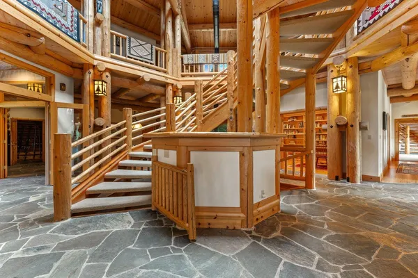 a view of a building with stairs and a yard