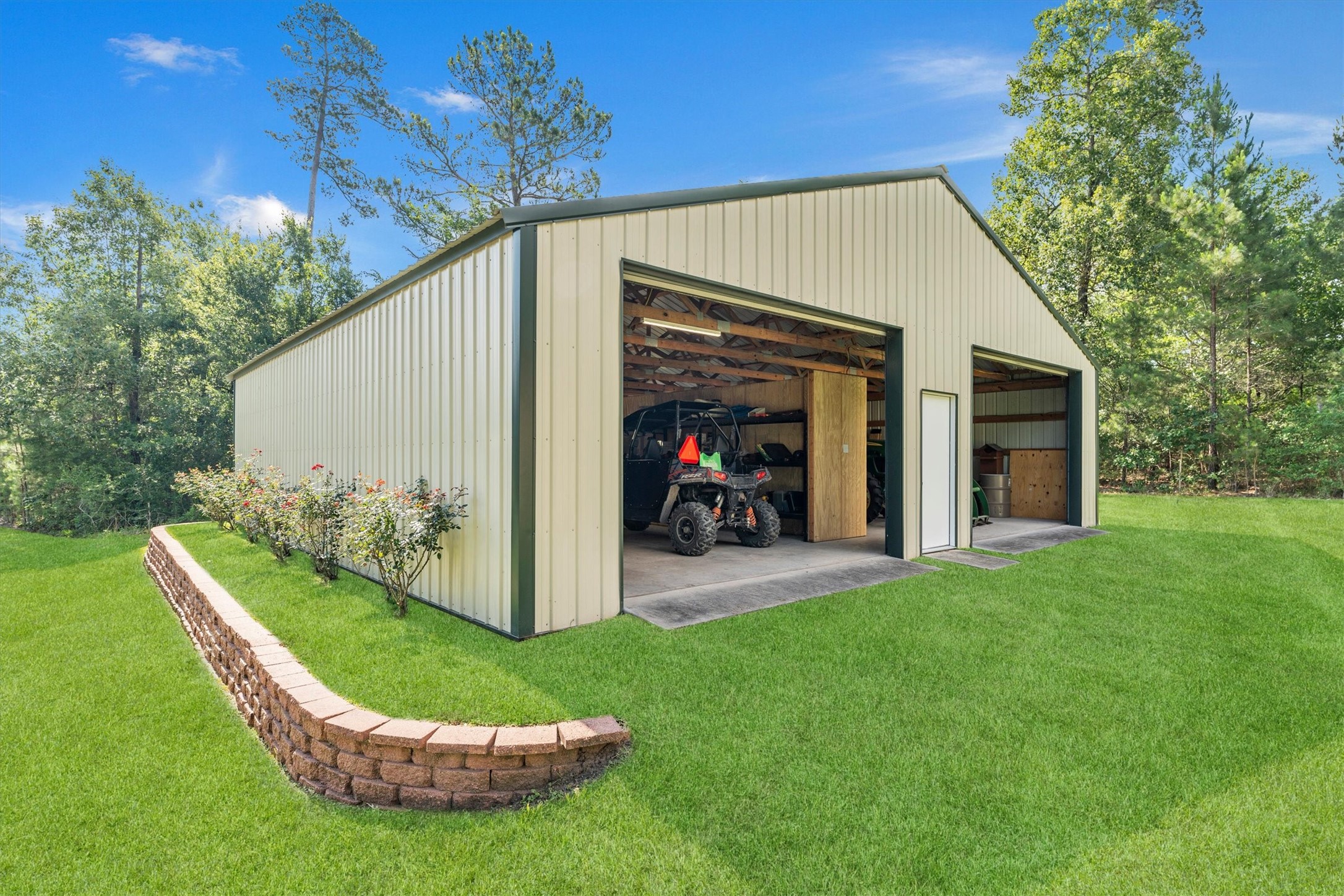 50 Fm 3179 Road Huntsville, TX 77320 - Photo 38 of 45 Workshop features four bay doors designed for convenience and functionality.