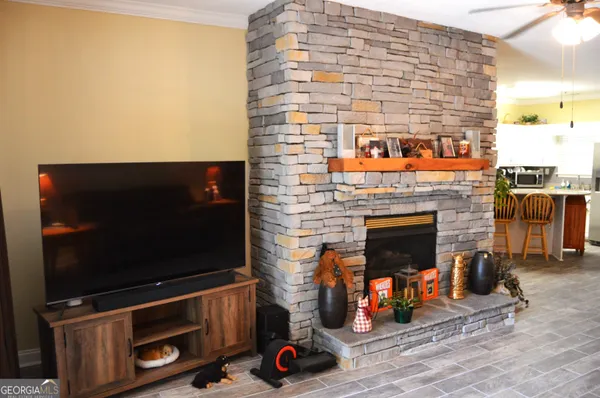a living room with furniture and a fireplace