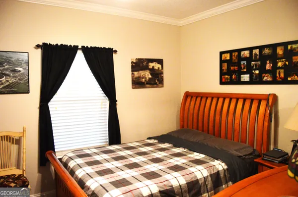 a bedroom with a bed and a book shelf