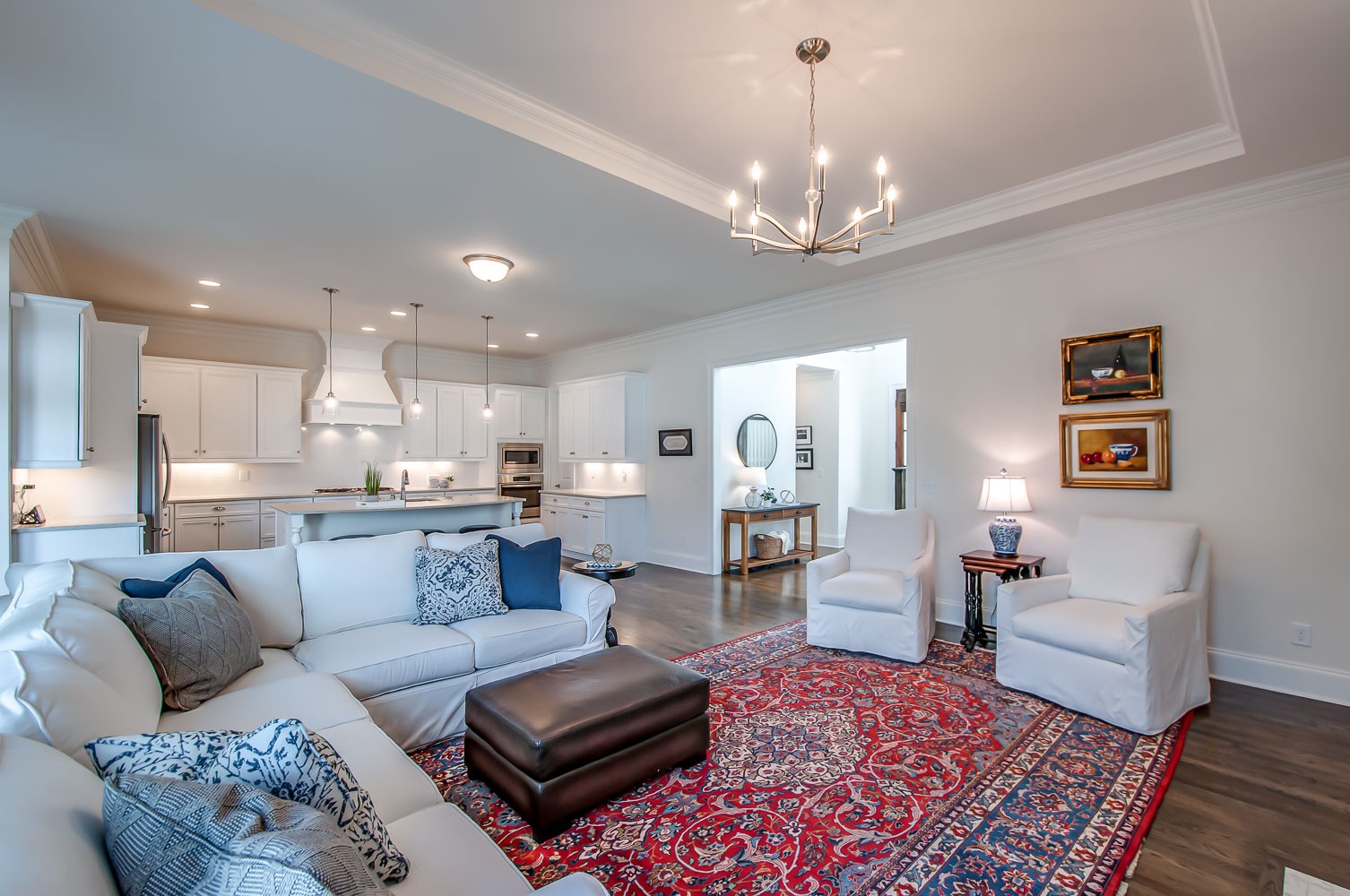 4030 General Martin Lane Franklin, TN 37064 - Photo 11 of 47 a living room with furniture a chandelier and a rug