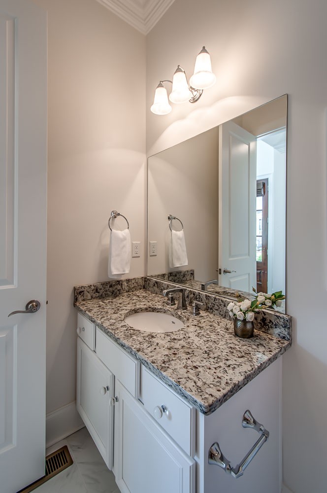 4030 General Martin Lane Franklin, TN 37064 - Photo 26 of 47 a bathroom with a granite countertop sink and a mirror