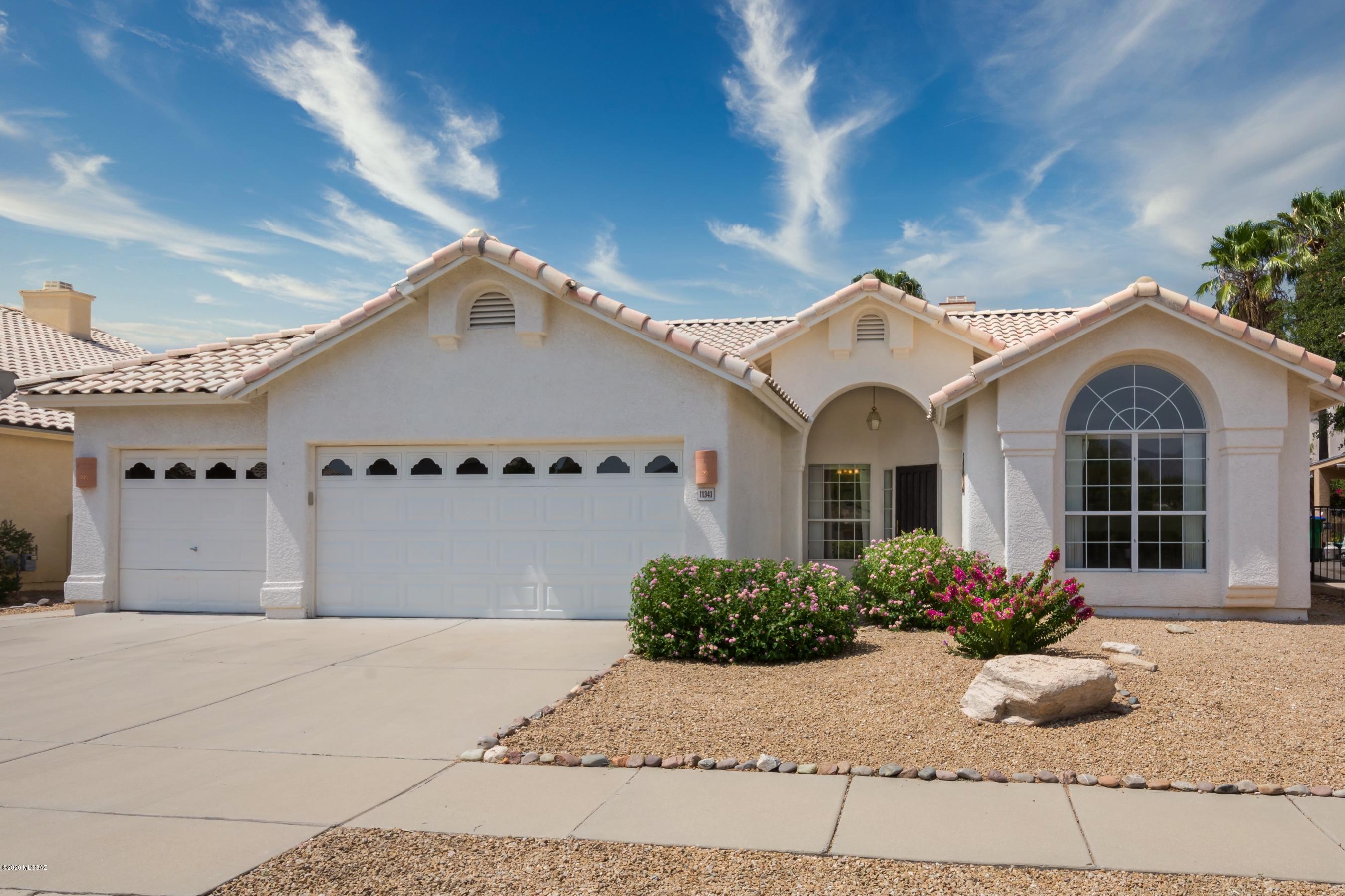 11341 Silver Pheasant Loop Oro Valley, AZ 85737 - Photo 1 of 41 a front view of a house
