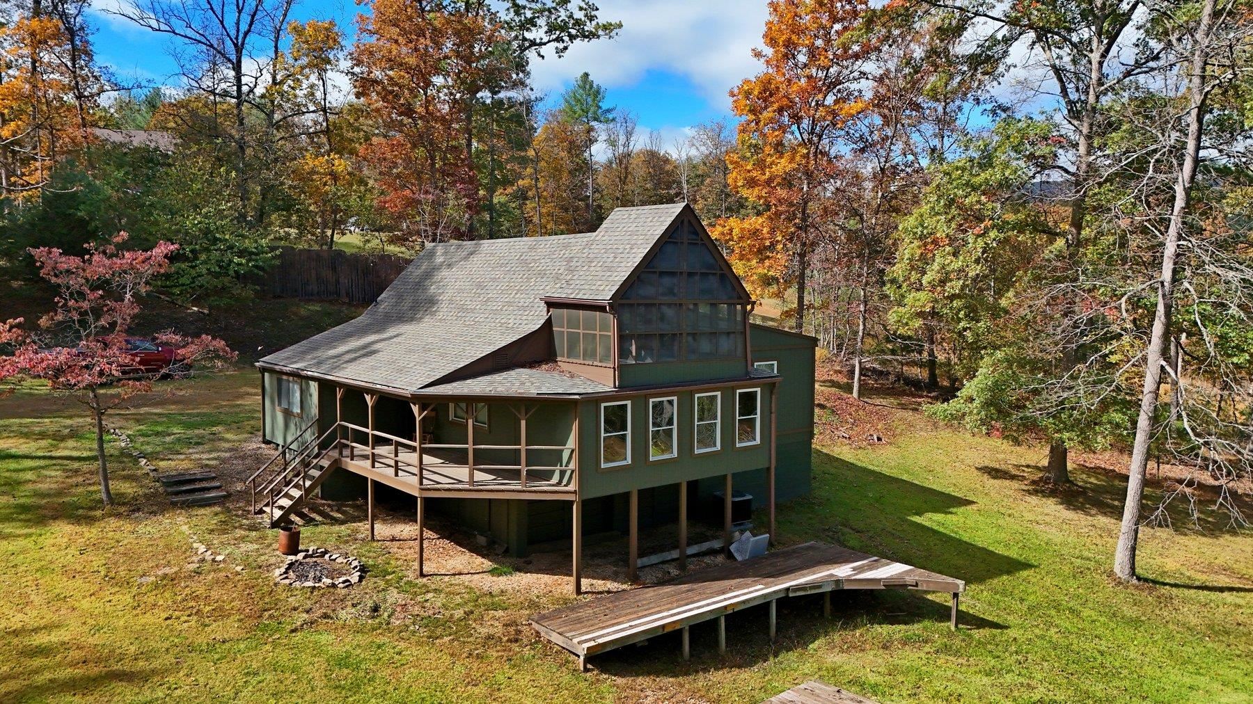 a view of a house with roof deck front of house