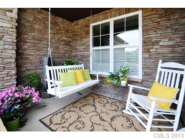 11640 Kyrene Road Charlotte, NC 28277 - Photo 2 of 16 a view of a chairs and table in the back yard of the house