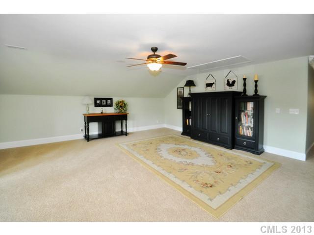 11640 Kyrene Road Charlotte, NC 28277 - Photo 14 of 16 a bedroom with a bed and a chandelier