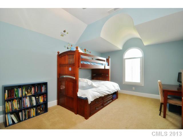 11640 Kyrene Road Charlotte, NC 28277 - Photo 15 of 16 a bedroom with a bed furniture and a book shelf