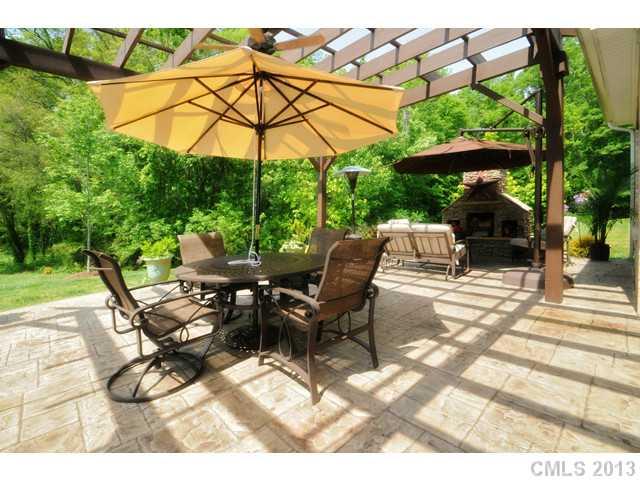 11640 Kyrene Road Charlotte, NC 28277 - Photo 4 of 16 a view of an outdoor space with furniture and umbrella
