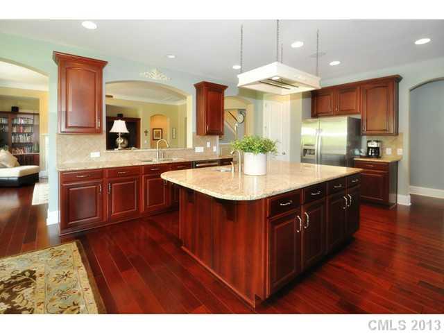 11640 Kyrene Road Charlotte, NC 28277 - Photo 6 of 16 a kitchen with kitchen island granite countertop a sink stove and cabinets