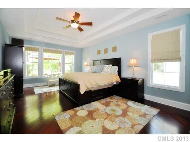 11640 Kyrene Road Charlotte, NC 28277 - Photo 10 of 16 a bedroom with a bed and wooden floor