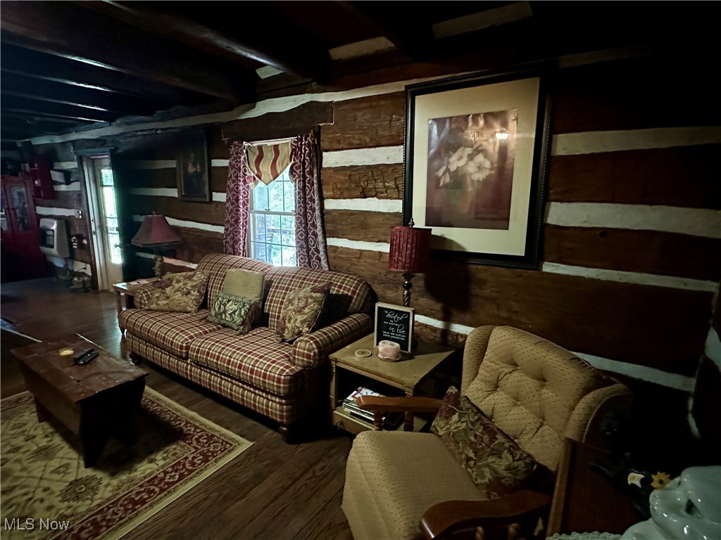 325 North Fork Road New Matamoras, OH 45767 - Photo 50 of 50 Living area with wooden walls, wood finished floors, and beamed ceiling