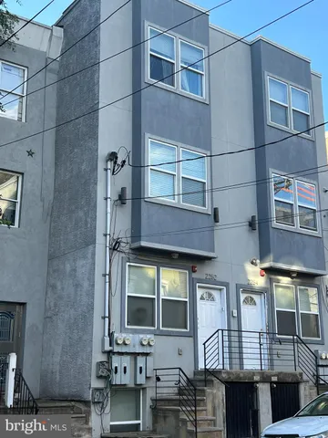 a front view of a building with glass windows