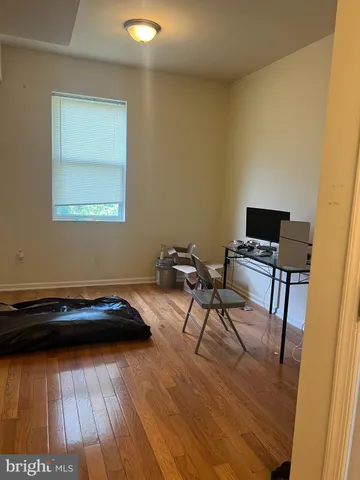 a bed sitting in a room next to a window