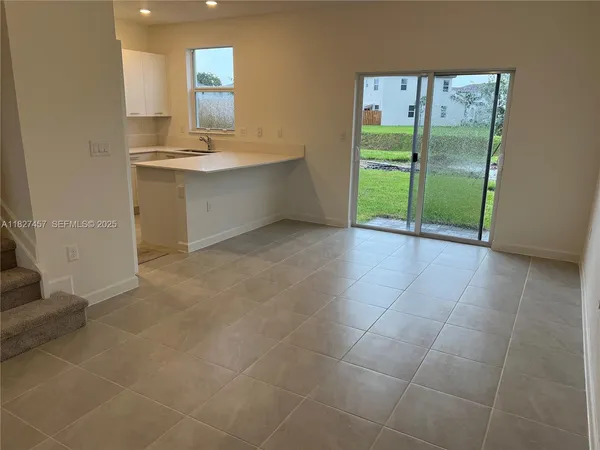 a bathroom with a sink and a large window