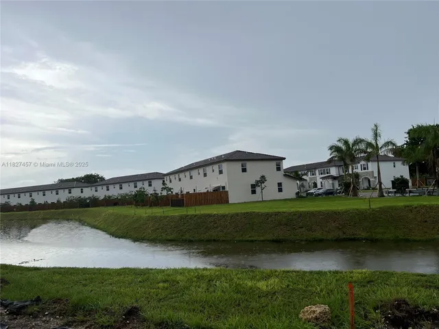 a view of a backyard of the house