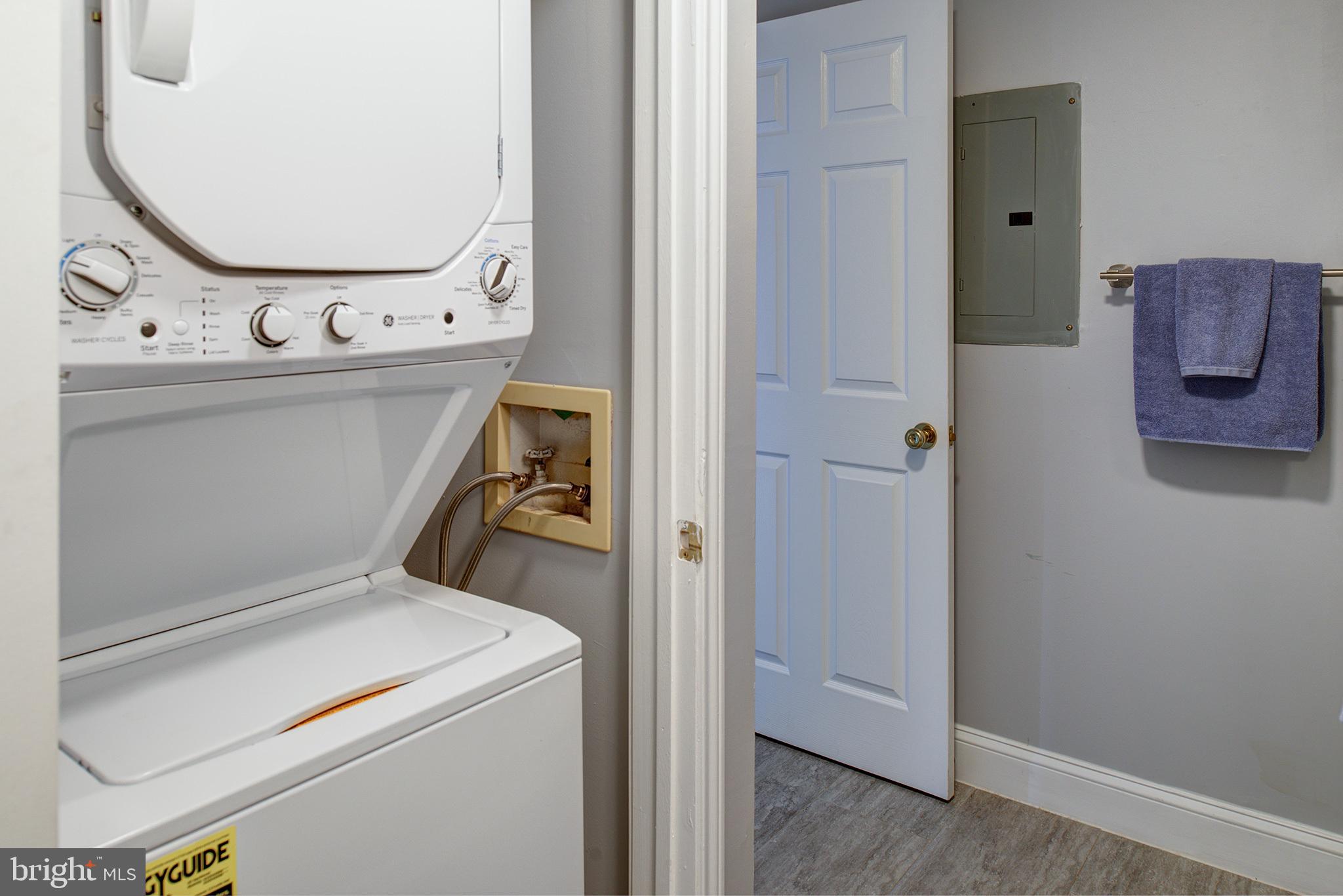 20951 Timber Ridge Terrace, Unit 202 Ashburn, VA 20147 - Photo 11 of 16 Stacking washer/dryer in the bathroom