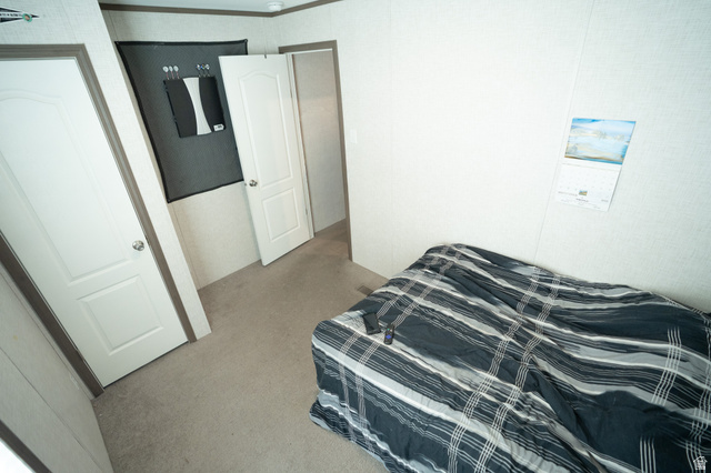 2491 Highway 89, Unit 111 Pleasant View, UT 84404 - Photo 14 of 20 Bedroom with light carpet