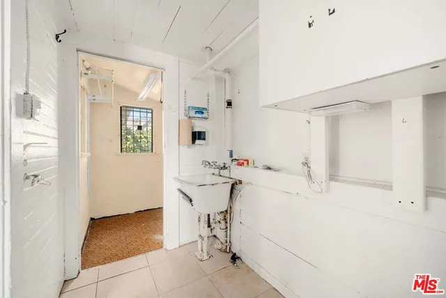 an empty room with closet and a ceiling fan