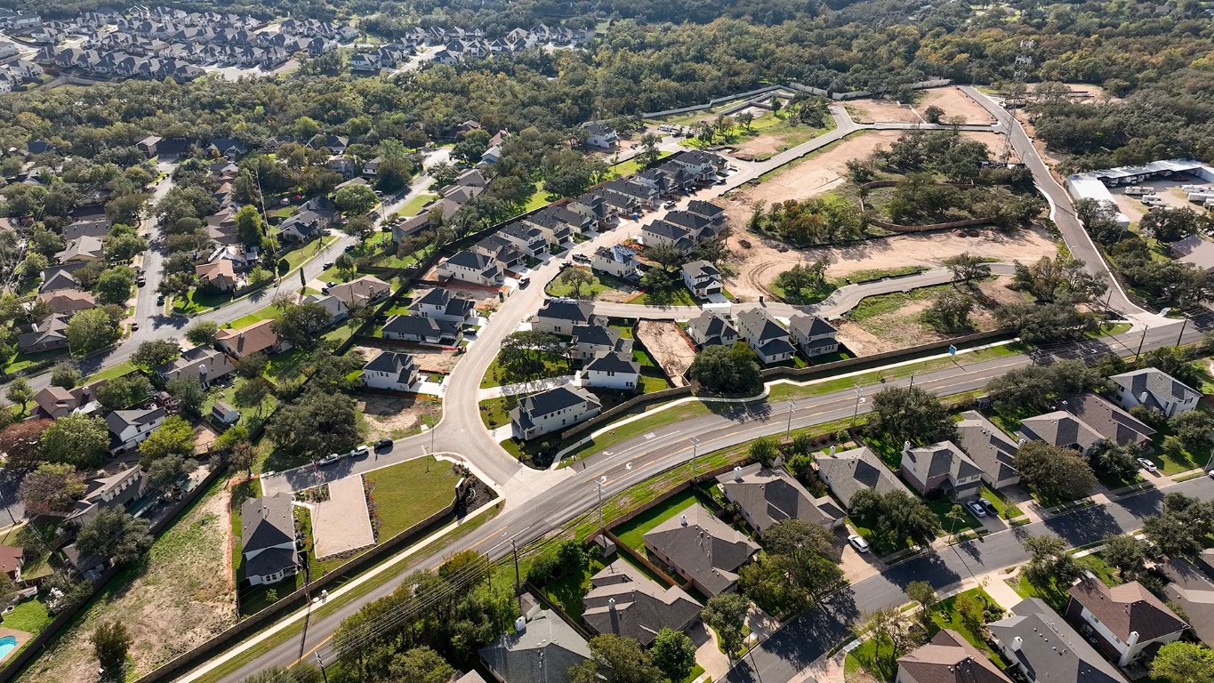 2605 Sam Bass Road, Unit 107 Round Rock, TX 78681 - Photo 3 of 11 an aerial view of residential houses with outdoor space