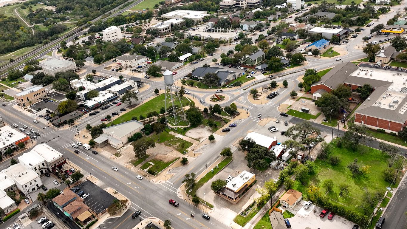 2605 Sam Bass Road, Unit 107 Round Rock, TX 78681 - Photo 8 of 11 an aerial view of a residential houses with outdoor space