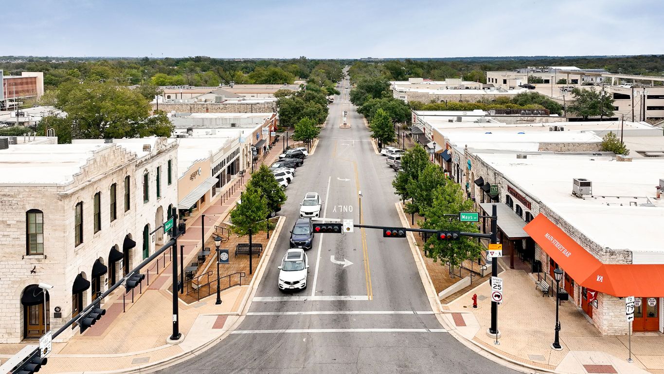 2605 Sam Bass Road, Unit 107 Round Rock, TX 78681 - Photo 9 of 11 a view of a city with tall buildings