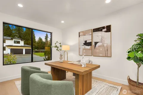 a view of an house with backyard space and balcony