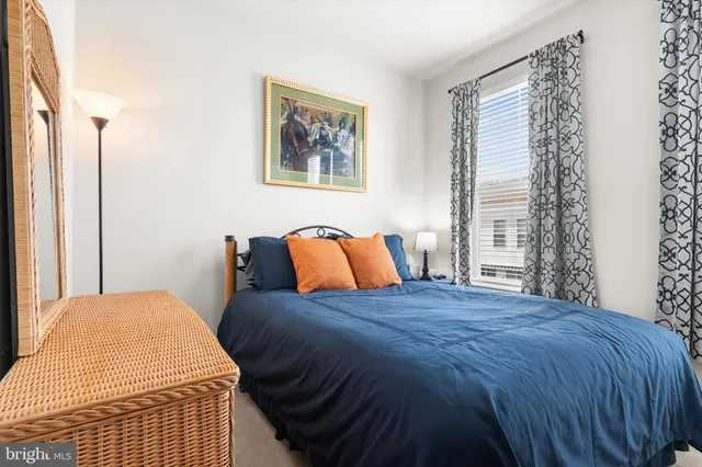 a bedroom with a bed and cupboard