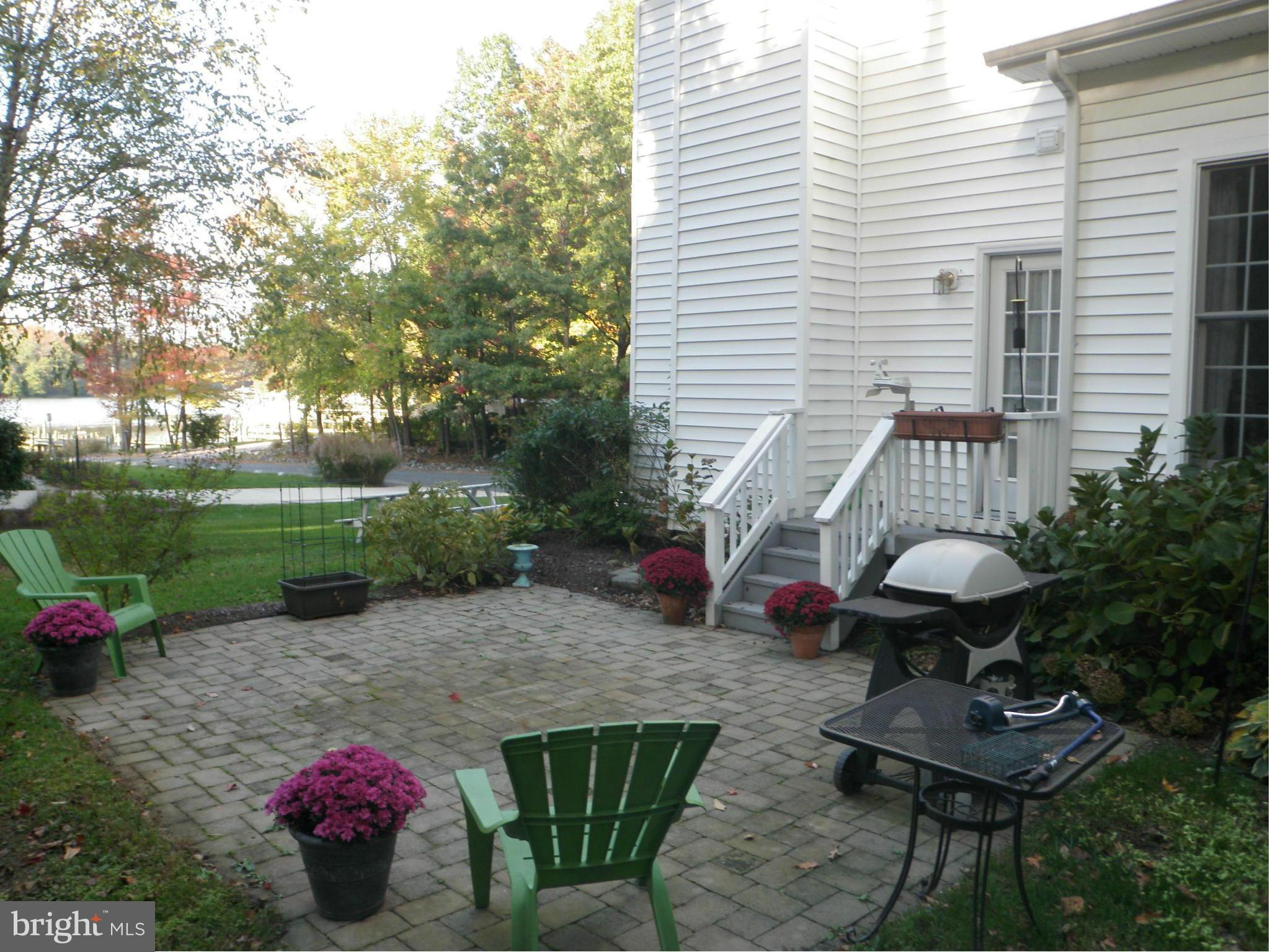 107 Shore Road Arnold, MD 21012 - Photo 3 of 30 View of the rear patio over looking at the water