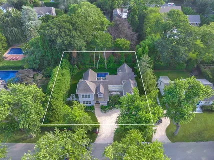 an aerial view of house with a yard