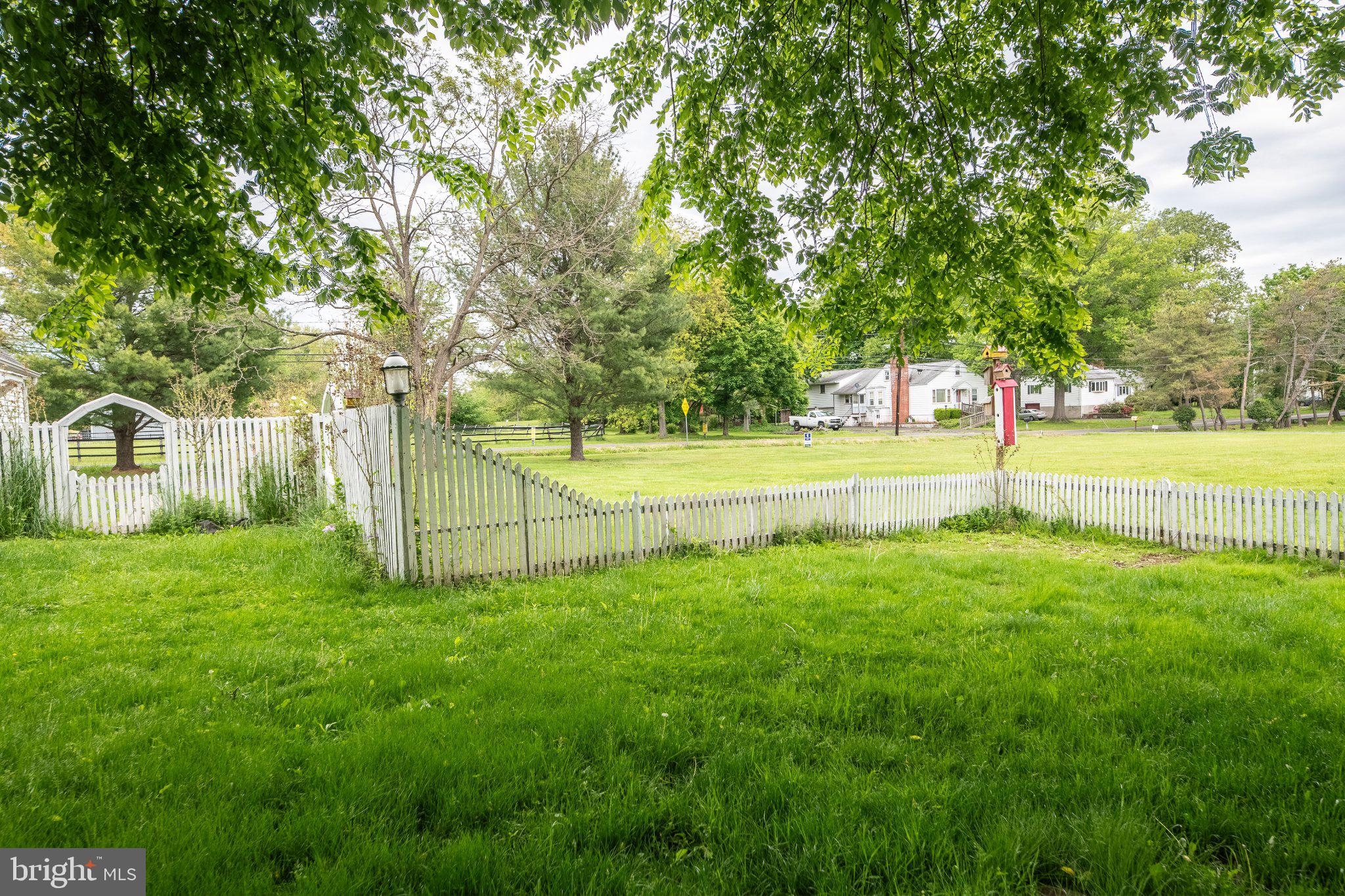 57 Diverty Road Pennington, NJ 08534 - Photo 45 of 86 Lush green yard with a white fence.