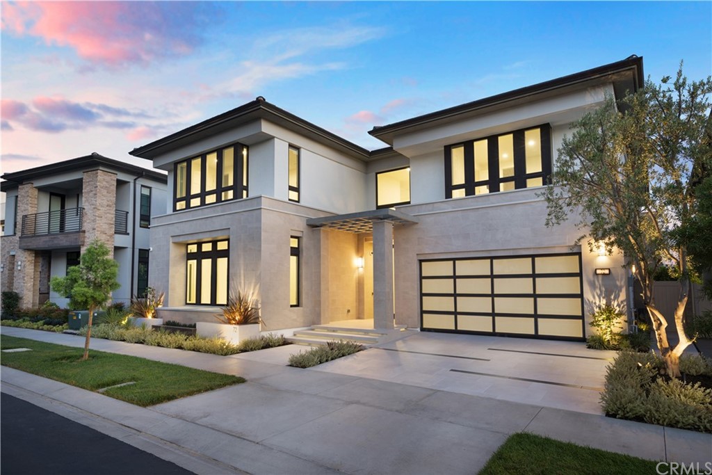 72 Hartman Irvine, CA 92618 - Photo 47 of 52 a front view of a house with a yard and garage