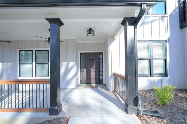 a view of a hallway with wooden floor and a fireplace