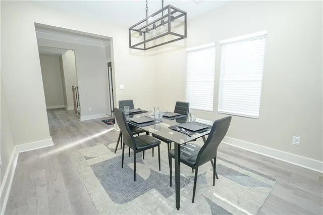 a view of a hallway with furniture and front door