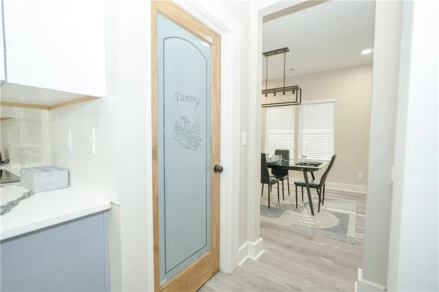 a bathroom with a sink mirror and vanity