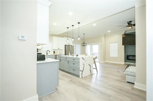 a kitchen with a sink stove and refrigerator