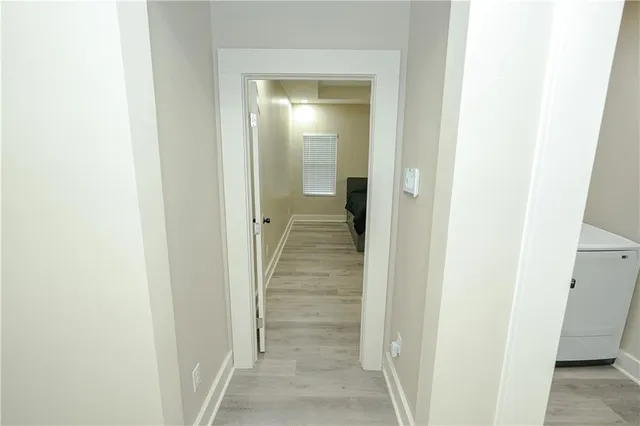 a bathroom with a toilet sink and a mirror