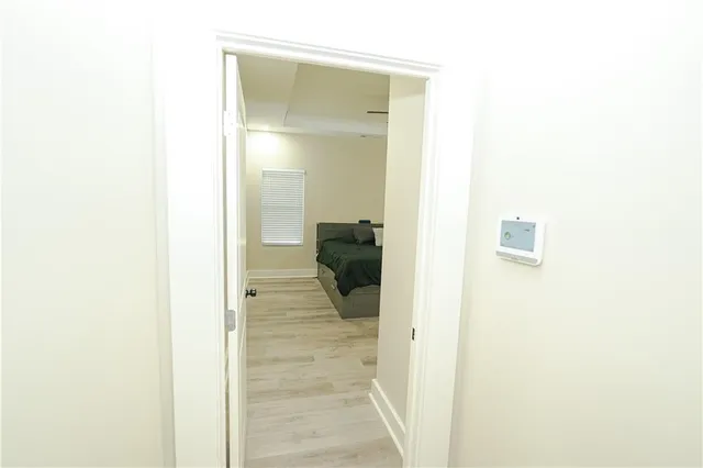 a bedroom with a bed and window