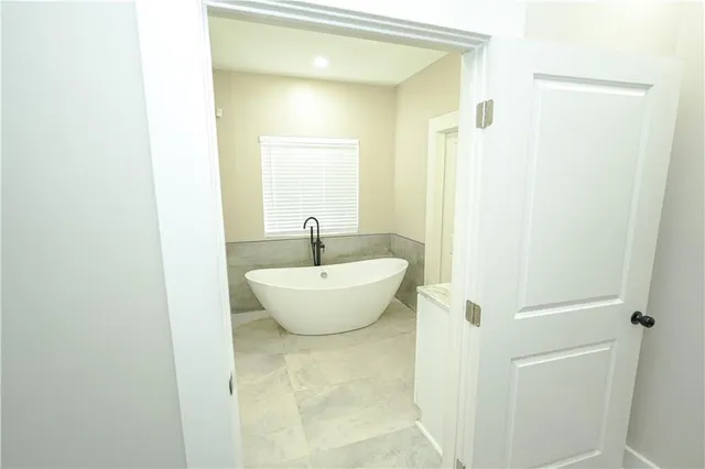 a bathroom with a sink and shower