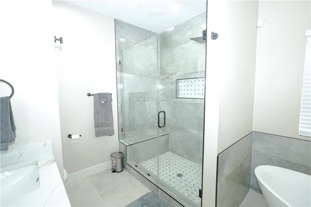 a bathroom with a shower and a toilet