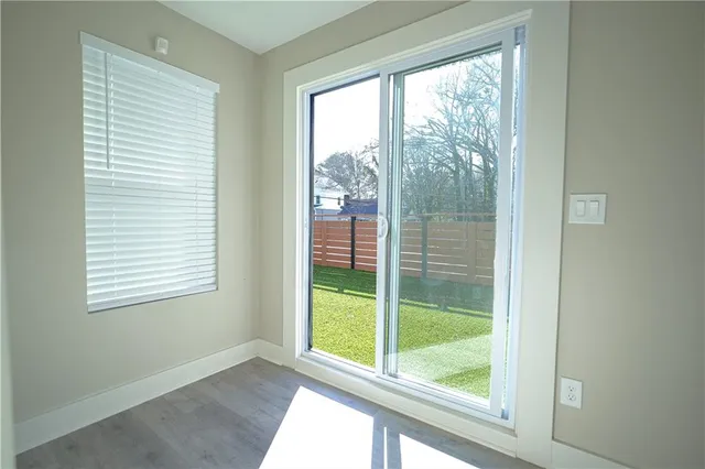 a view of a backyard with wooden fence