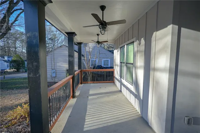 a view of a porch with wooden floor and outdoor space