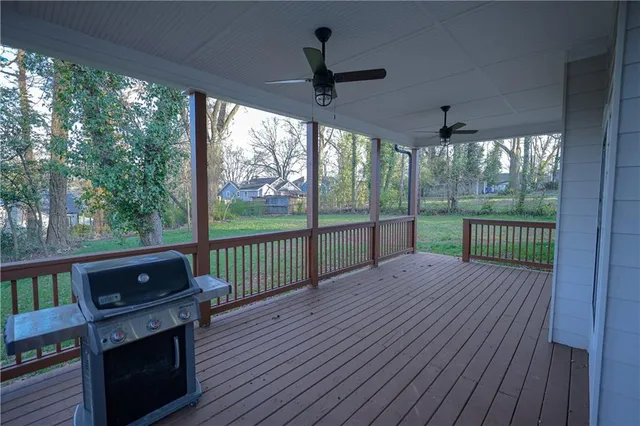 a view of a deck with wooden floor and outdoor space