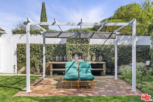 a view of yard with patio