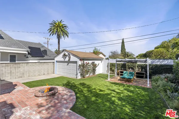 a view of a house with a yard porch and sitting area