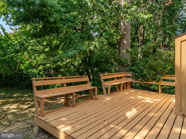 a view of a wooden deck with a bench