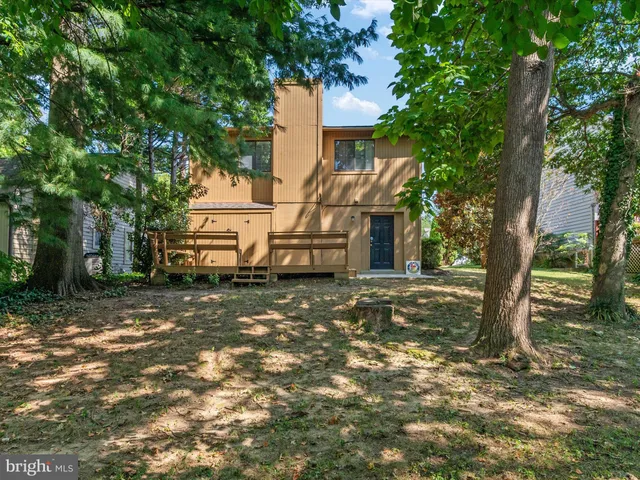 a view of a house with a tree